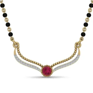 Garima red gemstone diamond mangalsutraCaption: Garima Red Gemstone Diamond Mangalsutra Description: Sophisticated mangalsutra with a vibrant red center gemstone, diamond detailing, gold accents, and black beads.